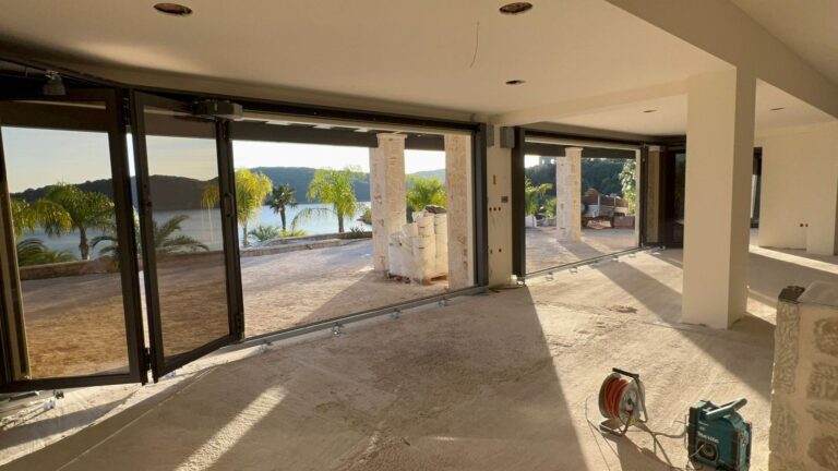 ALPGATE Sliding Folding Doors: Aesthetic Appeal and Functionality in an exposed coastal location!